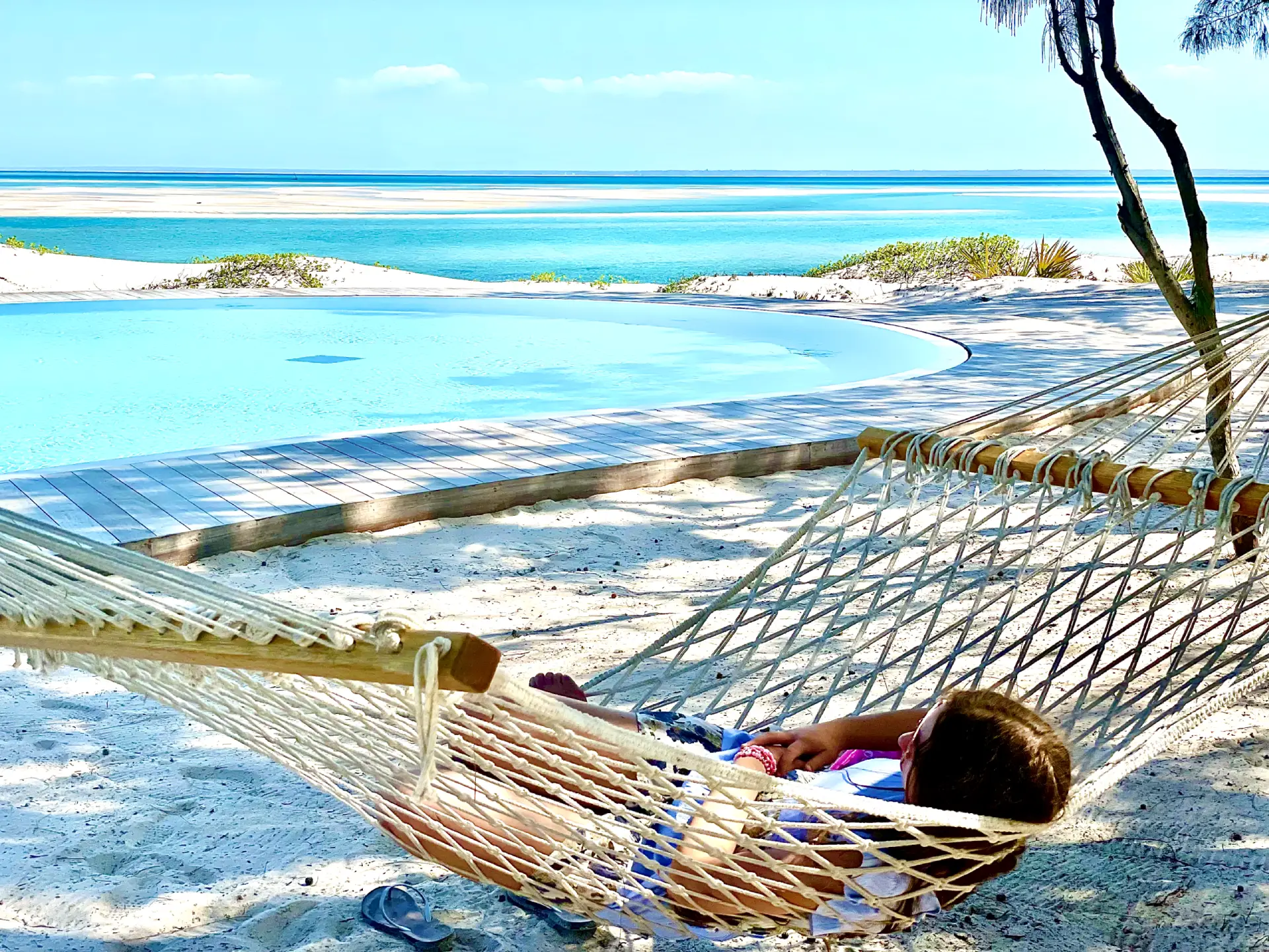 Someone relaxing in a hammock on the sunny beaches of Mozambique